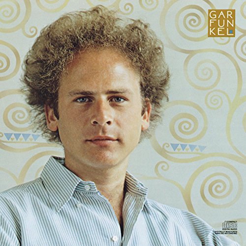 A man with curly, light brown hair wearing a light blue striped shirt standing in front of a background with swirling patterns and a 'Garfunkel' logo in the top right corner.