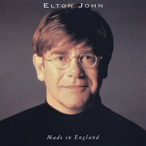 Album cover featuring a portrait of Elton John wearing glasses and a black shirt, with the text "Elton John" at the top and "Made in England" at the bottom.