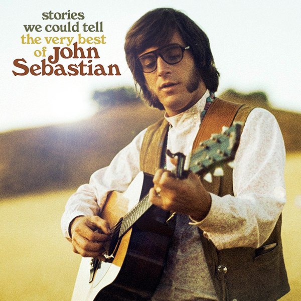 Album cover featuring John Sebastian playing guitar outdoors with a field in the background, with the text "stories we could tell the very best of John Sebastian" in the upper left corner.