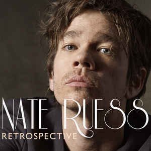 Close-up portrait of Nate Ruess with text 'RETROSPECTIVE'