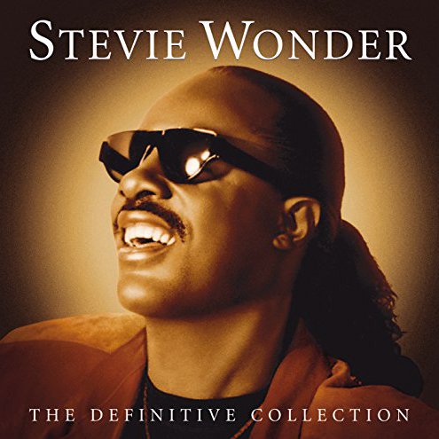 Album cover of Stevie Wonder titled 'The Definitive Collection', featuring Stevie Wonder smiling with sunglasses, a mustache, and a brown jacket.